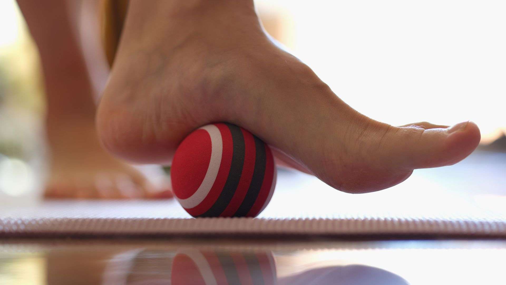 foot on massage ball