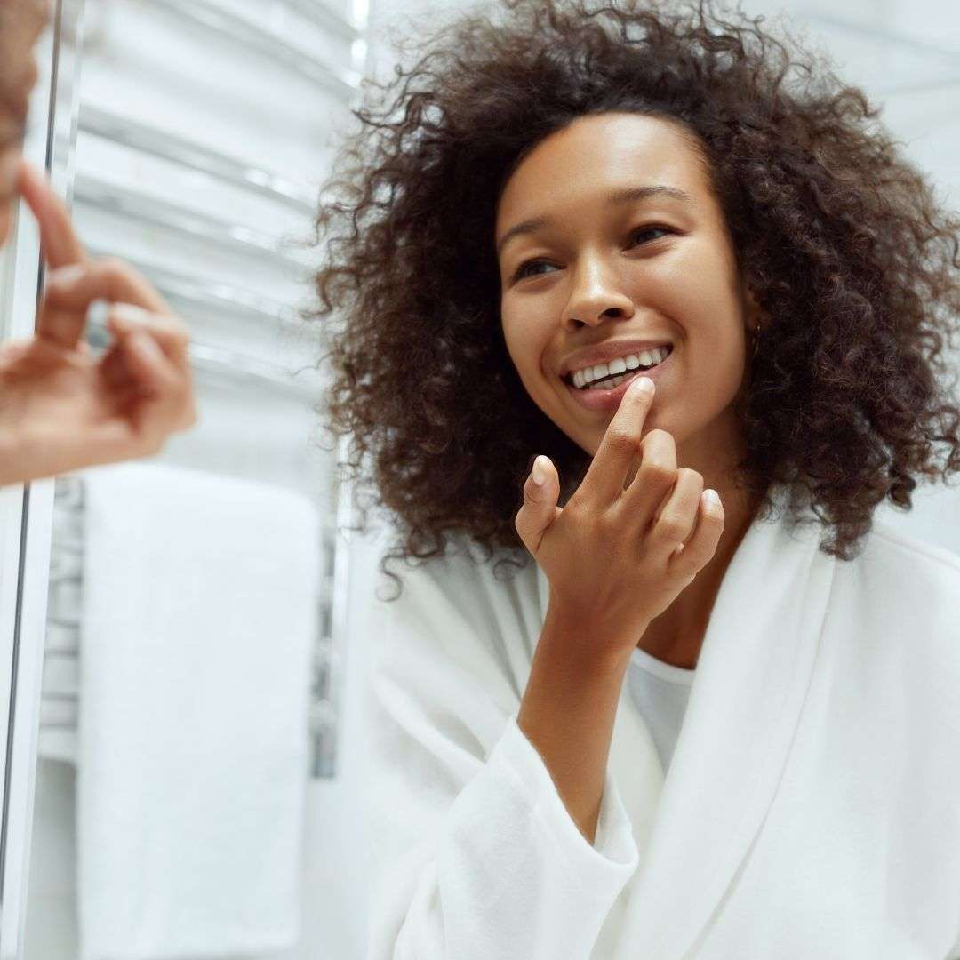 Woman touching her lip