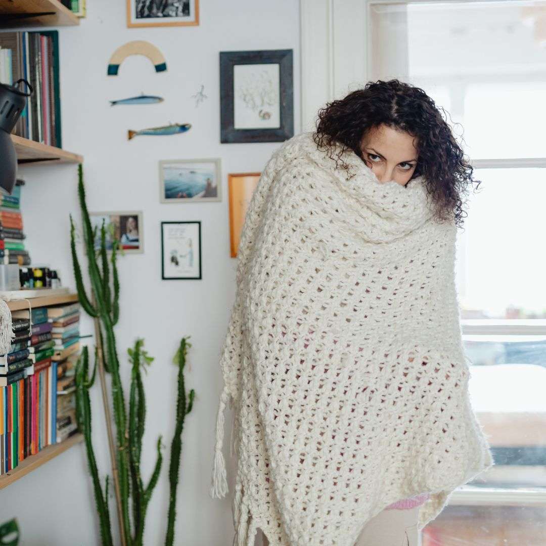 woman wrapped in white blanket