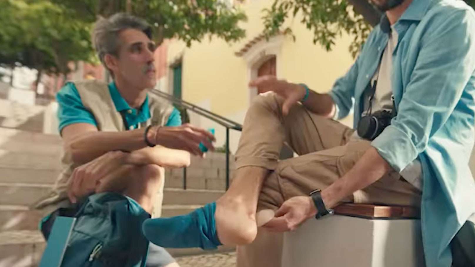 Somebody putting a blister plaster on their heel